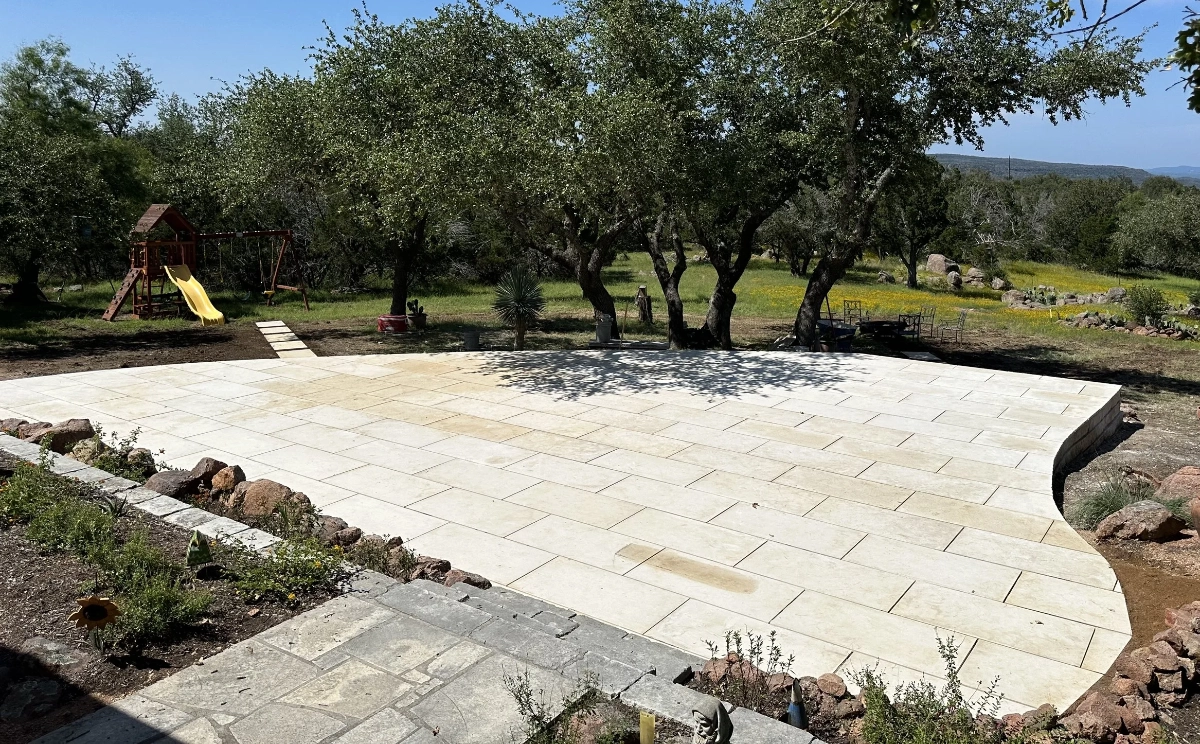 Large concrete paving and outdoor patio area built by H3 Masonry and Construction in the Texas Hill Country